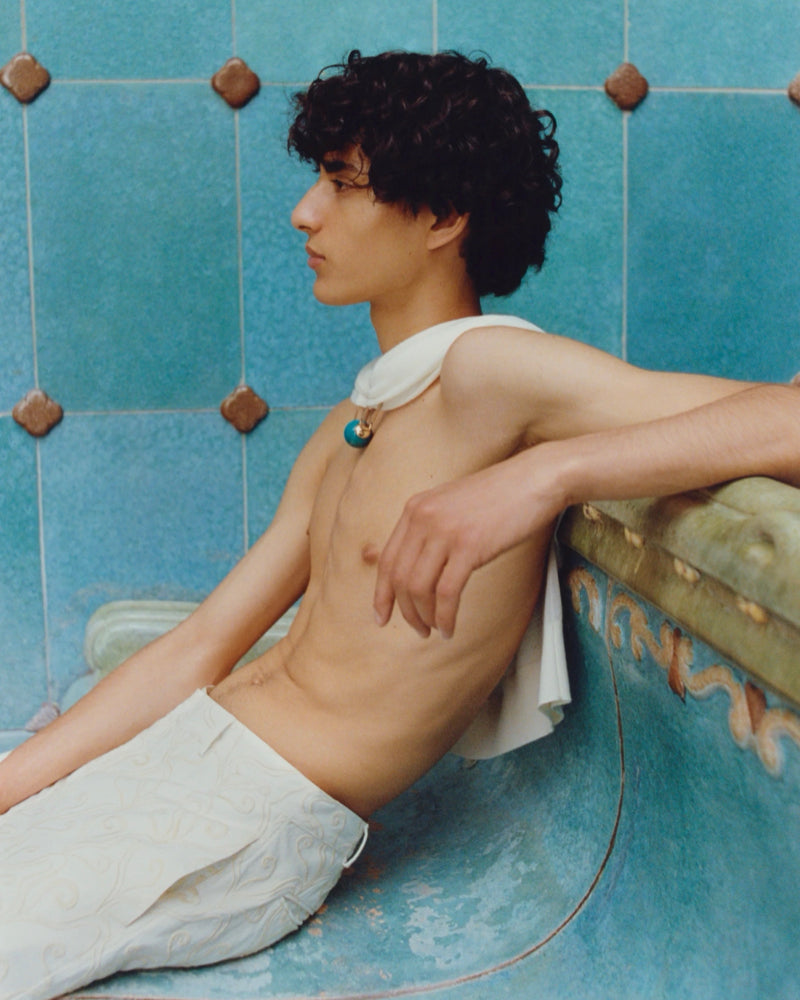 COMMAS RESORT 2024 COLLECTION: Model Wears Embroidered Currents Trousers in Bath House