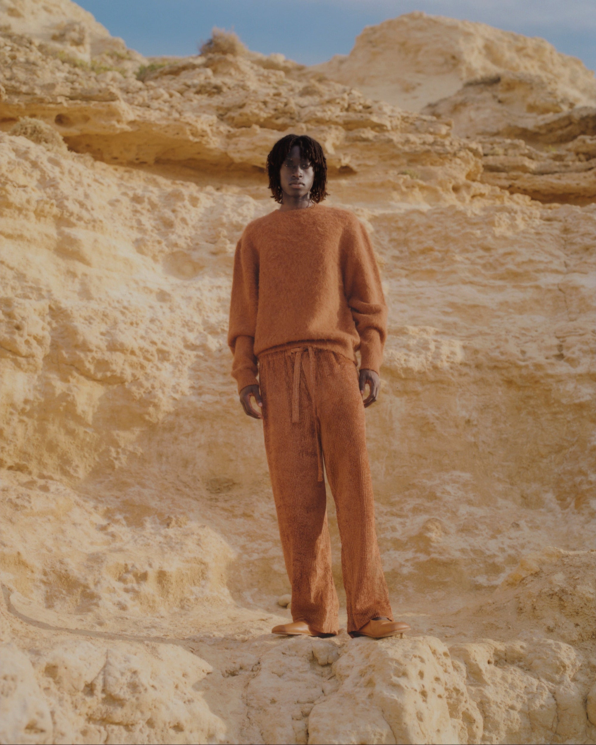 Campaign image of men's corduroy trousers.