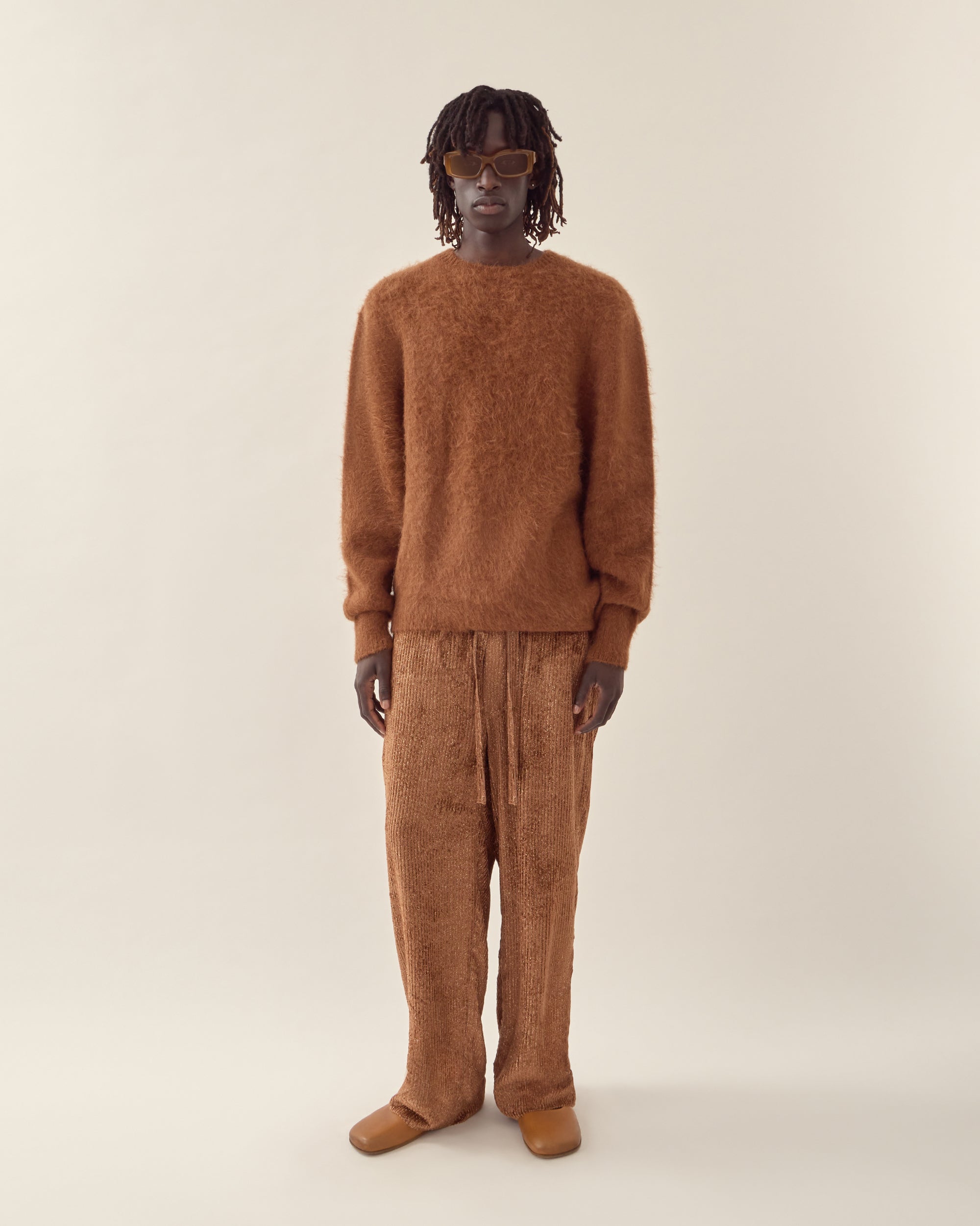 front view of men's burnt orange corduroy trouser in orange.