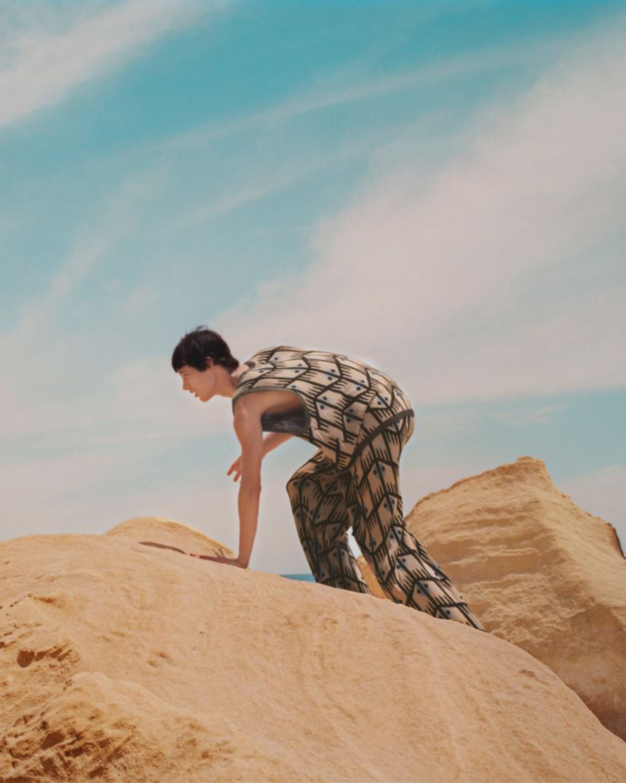 Campaign image of men's jacquard tank and trousers.