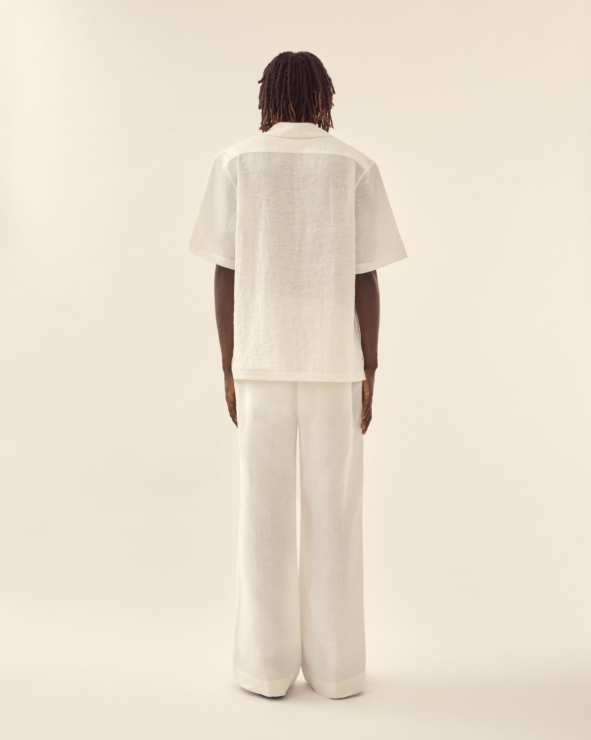 Back view of men's nautical shirt in white.