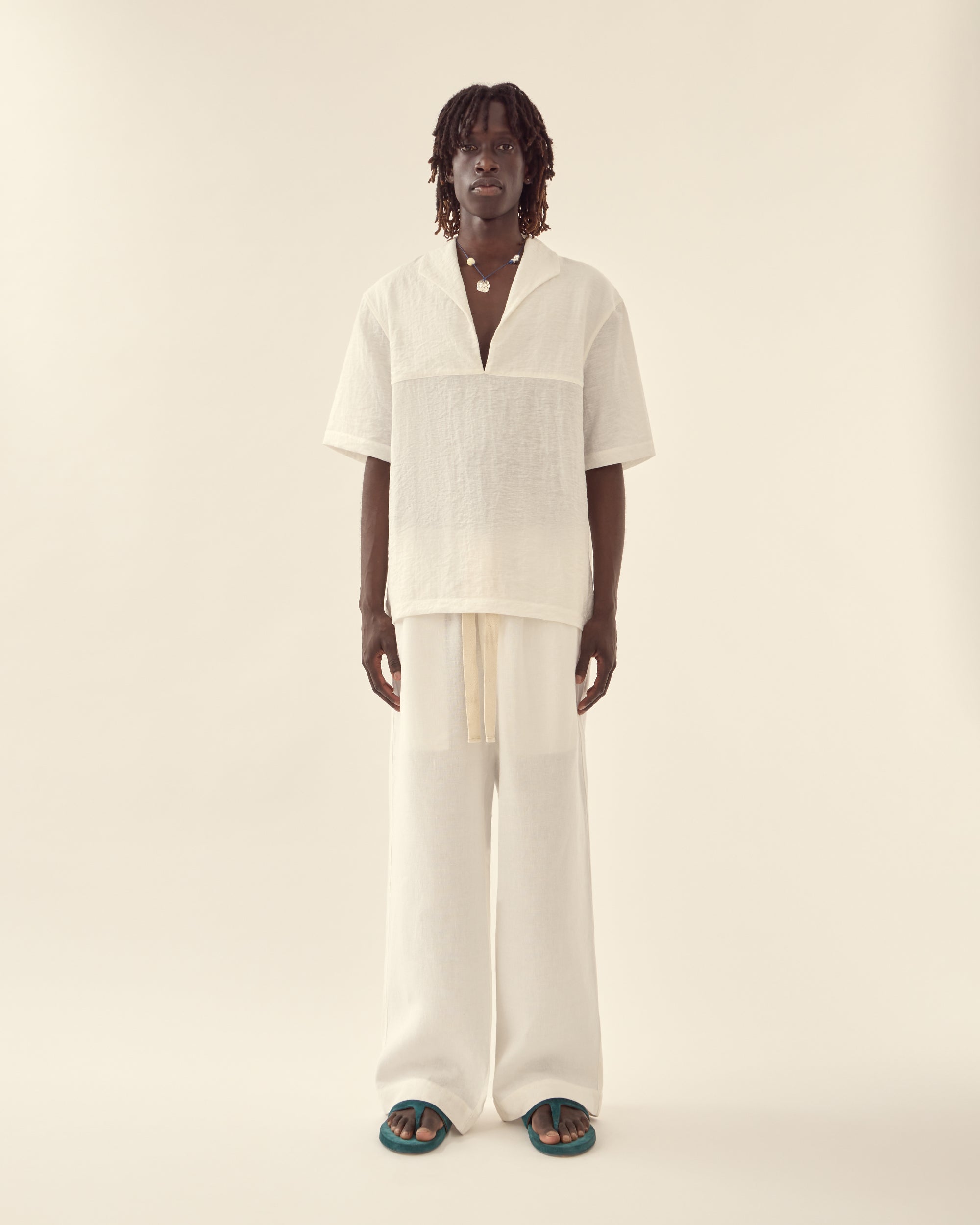 Front view of men's nautical shirt in white.