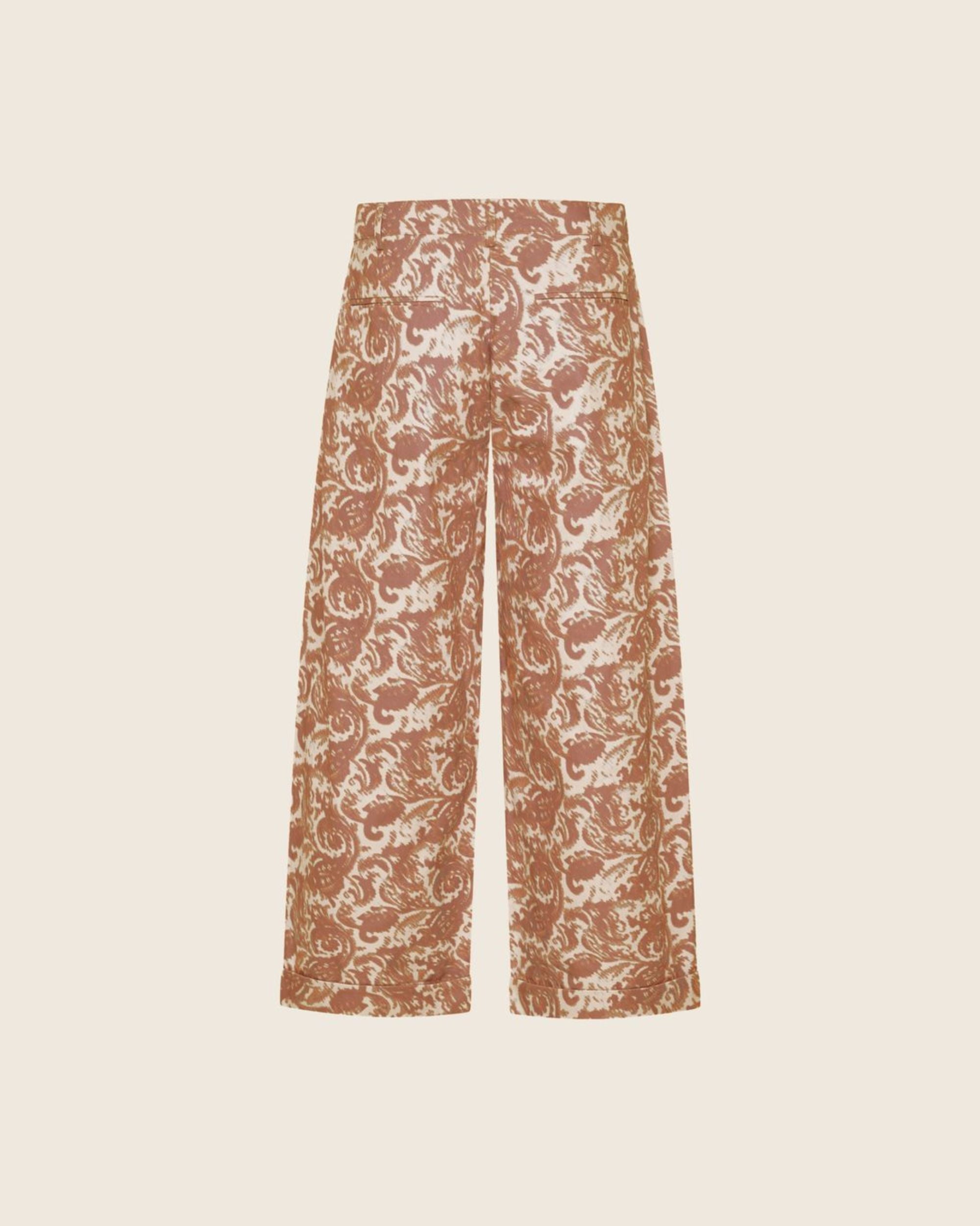 ghosted back image of paisley print trouser in coffee and cream