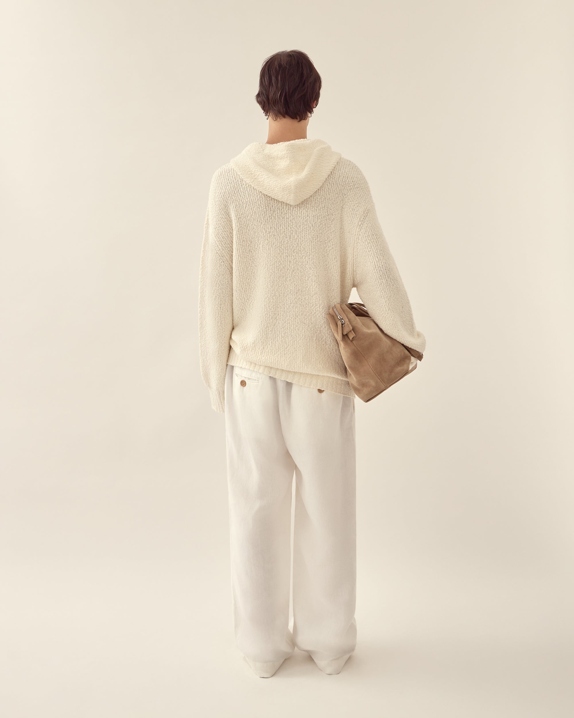 Back view of men's relaxed knit hoodie in white.