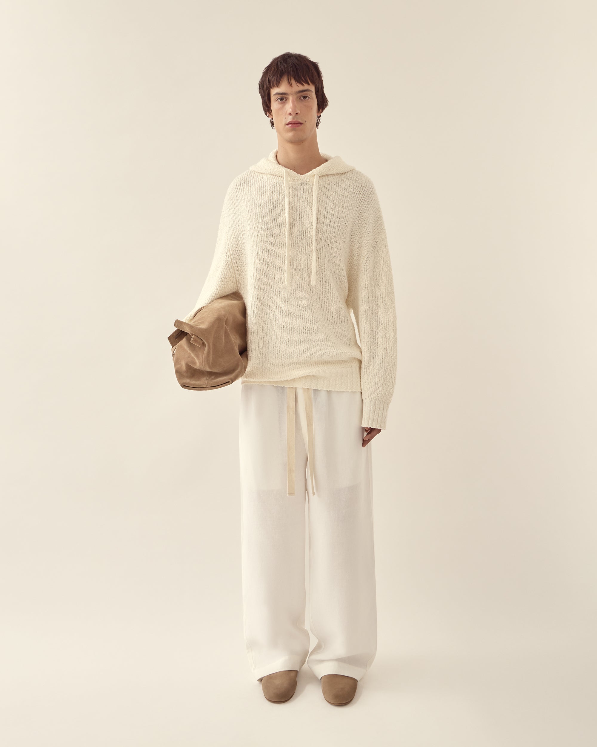 Front view of men's relaxed knit hoodie.