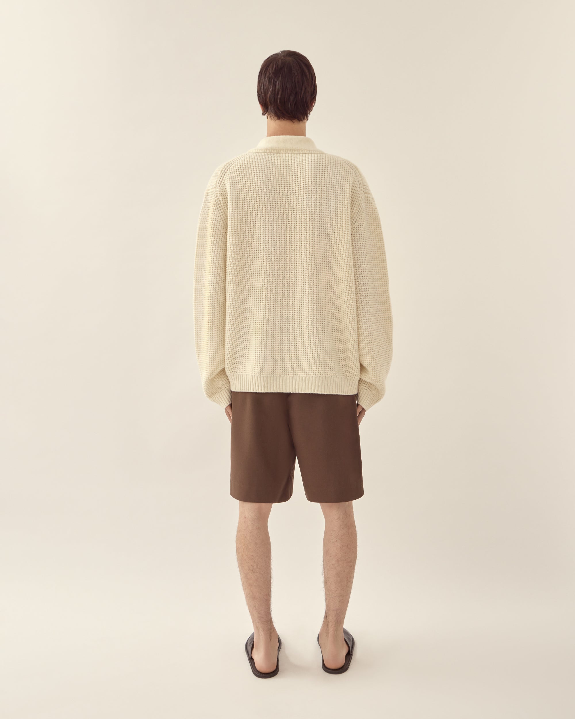 Back view of men's wool cashmere collared sweater in off white.