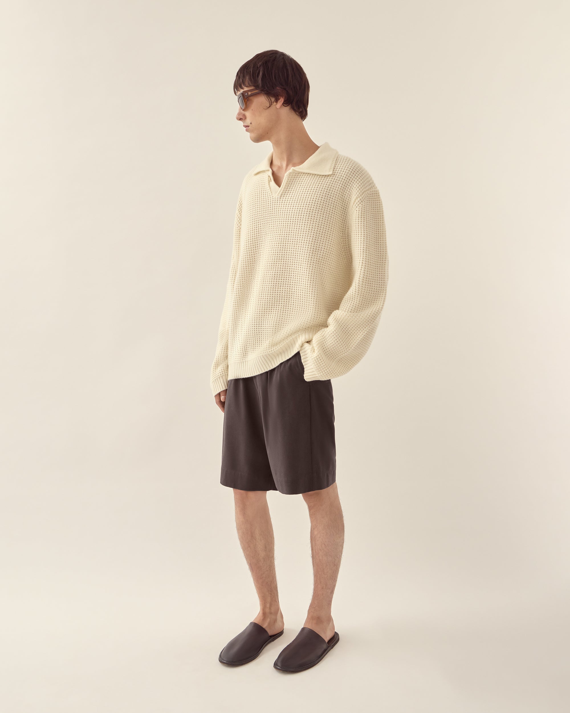 Side view of men's wool cashmere collared sweater in off white.