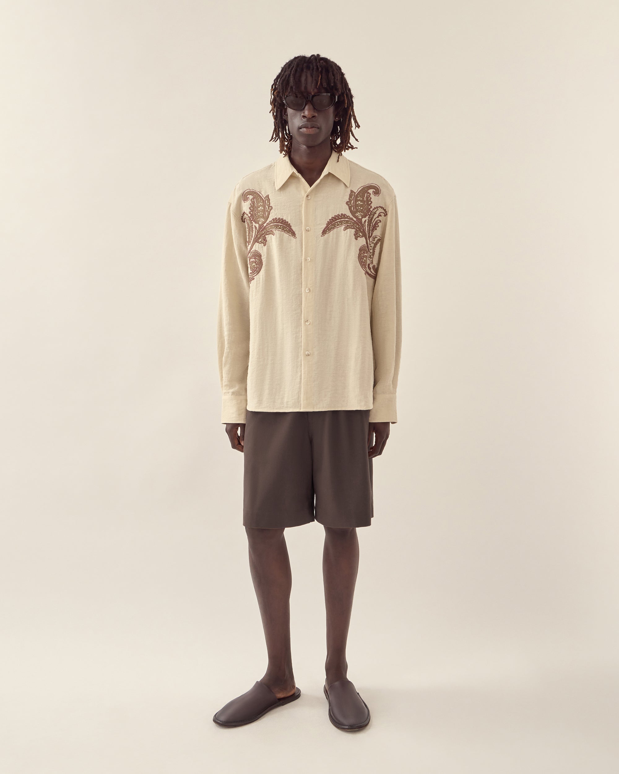 Front view of men's textured linen tailored short in chocolate.