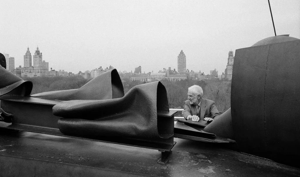 Sculptor Anthony Caro with his work After Olympia by Jack Manning, NY Times, 1988